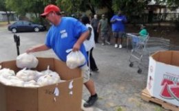 TORIN HALSEY/TIMES RECORD NEWS Wes Shepherd of the Wichita Falls Area Food Bank distributes fresh fruits and vegetables with the Produce Express program Friday afternoon at Mount Pleasant Baptist Church. Every week, produce to feed 80-150 families is distributed along with recipe cards on how to prepare some of the produce.